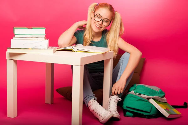 Dreamy schoolgirl with hairstyle as Pippi Longstocking and big e — Stock Photo, Image