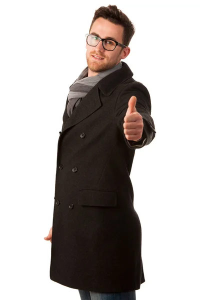 Confident businessman standing in winter coat showing a success — Stock Photo, Image