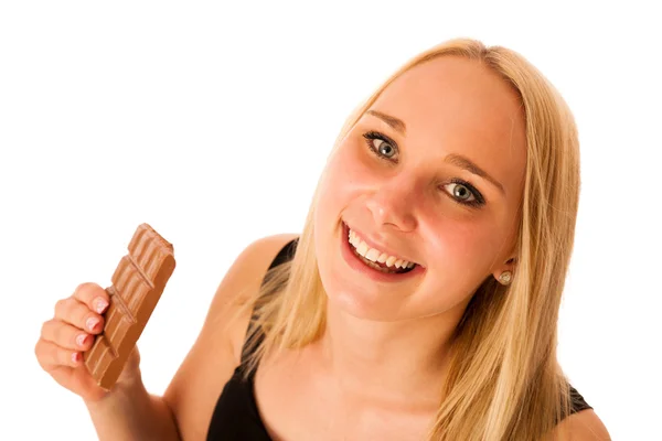 Mooie jonge vrouw eet chocolade geïsoleerd over witte backgro — Stockfoto
