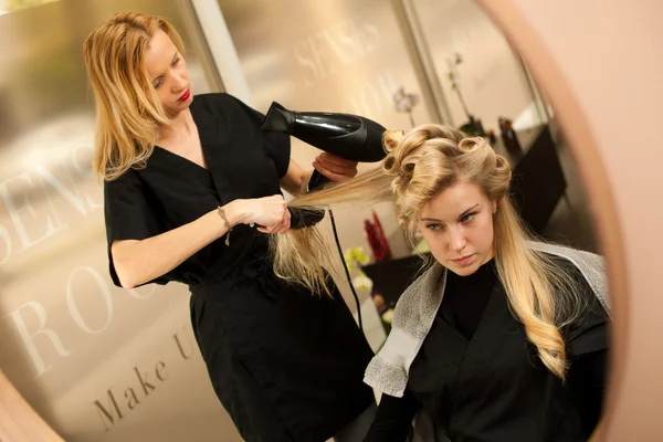 Professional hair stylist at work - hairdresser  doing hairstyle — Stock Photo, Image