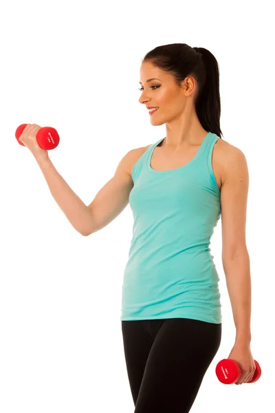 用哑铃锻炼在健身房孤立在活跃妇女 — 图库照片