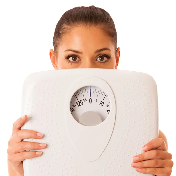 Woman with scale as a healthy lifestyle reminder isolated over w — Stock Photo, Image
