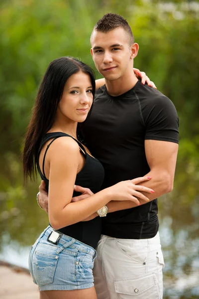 Teenage couple on a late summer afternoon in park — Stock Photo, Image