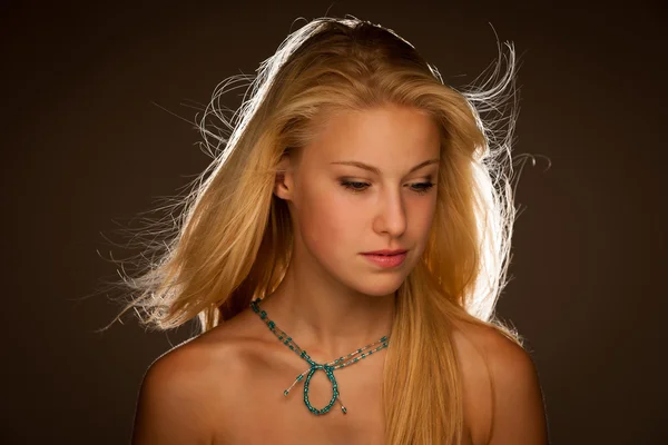 Beauty portrait of attractive young woman with blue eyes — Stock Photo, Image