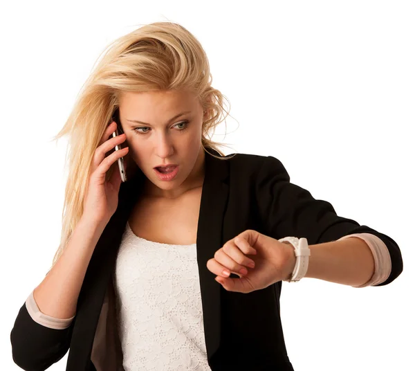 Young blonde woman looks at her watch when she is being late iso — Stock Photo, Image