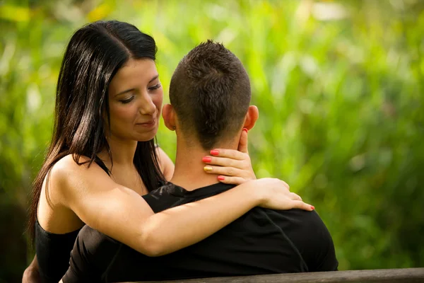 Teenage couple on a late summer afternoon in park — Stock Photo, Image