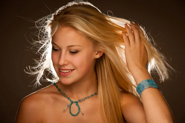 Beauty portrait of attractive young woman with blue eyes — Stock Photo, Image