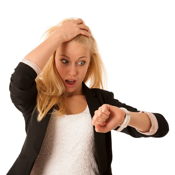 Young blonde woman looks at her watch when she is being late iso — Stock Photo, Image