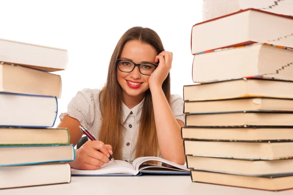 Happy asian caucasian girl lerning in study woth lots of books o — Stock Photo, Image