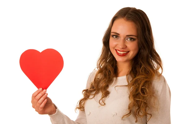 Attractive asian caucasian woman holding red heart in her hands — Stock Photo, Image