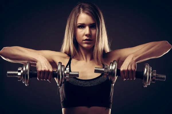 Attractive young woman working out with dumbbells - bikini fitne — Stock Photo, Image