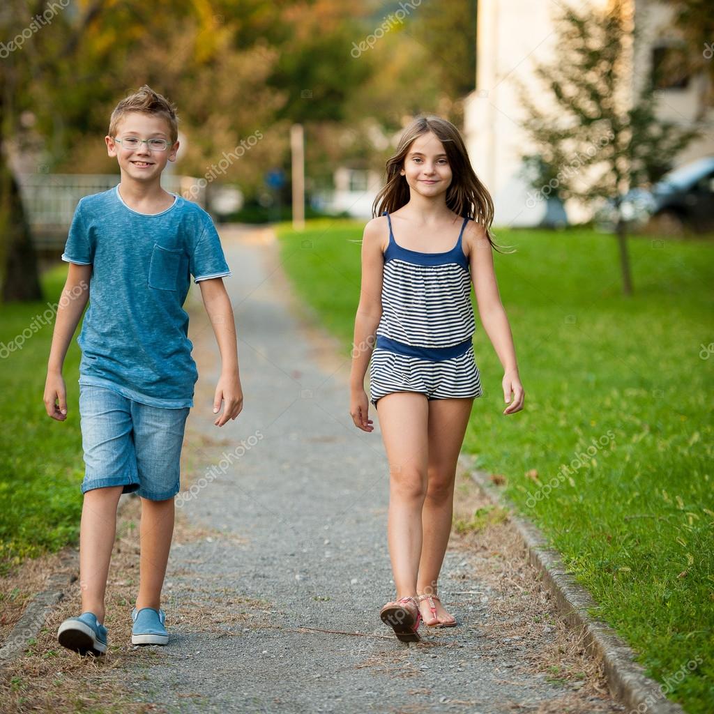 Young teenage boy and girl walk in park in the city � Stock Photo ... amateur Xxx Pic Hd Young teenage boy and girl walk in park in the city � Stock Photo ... photo