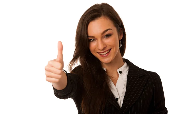 Besutiful business woman gesturing success with showing thumb up Stock Picture