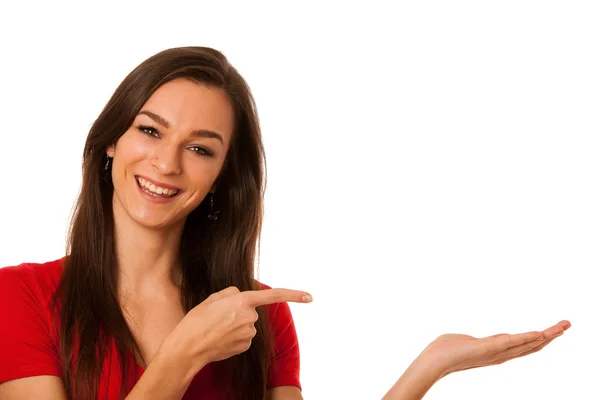 Joven mujer de negocios apuntando al espacio de copia, mostrando un producto i —  Fotos de Stock