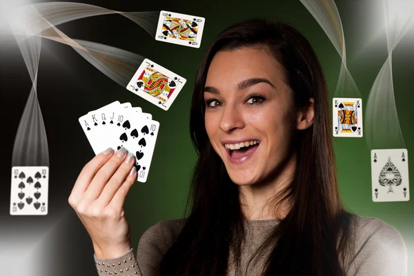 Beautiful caucasian woman with poker cards gambling in casino — Stock Photo, Image