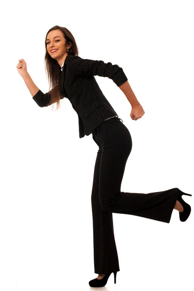Schöne junge Geschäftsfrau läuft isoliert über weißen Rücken — Stockfoto