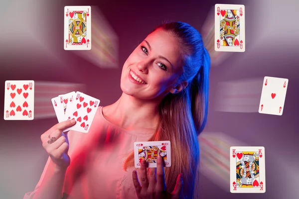 Beautiful caucasian woman with poker cards gambling in casino — Stock Photo, Image