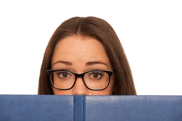 Stressed asian caucasian woman student learning in tons of books — Stock Photo, Image