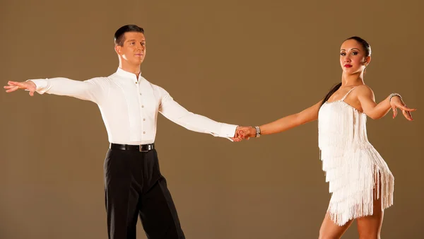 Latino dance couple in action - dancing wild samba — Stock Photo, Image