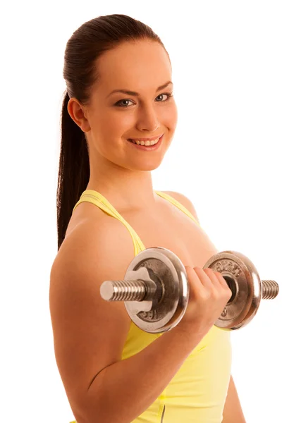 Belle jeune femme travaillant avec des haltères dans le gymnase de remise en forme — Photo