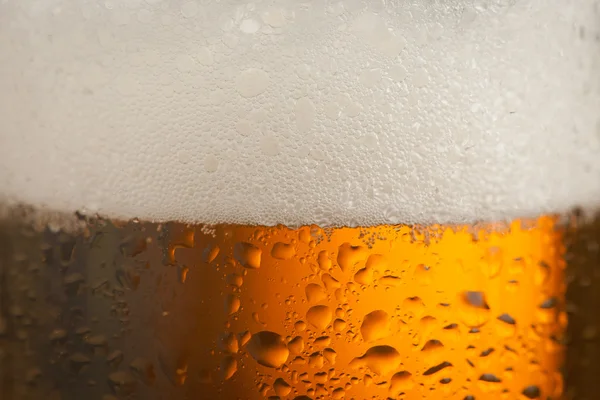 Big glass with handle filled with fresh beer with a lot of foam — Stock Photo, Image