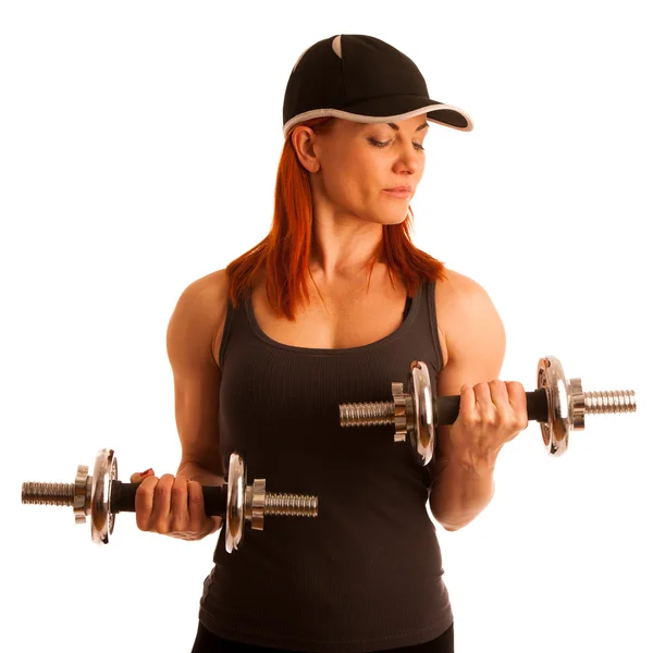 Vacker ung kvinna som arbetar med dumbels i fitness gym — Stockfoto