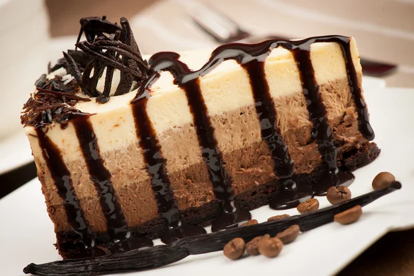 Chocolate cake with dark chocolate syrup — Stock Photo, Image