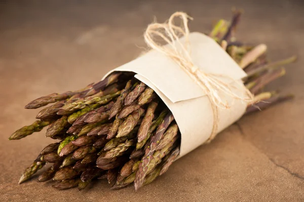 Fresh wild asparagus bought on market ready to be cooked — Stock Photo, Image