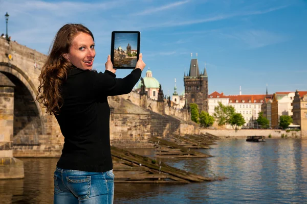 Beautiful young tourist woman photographing sites in Prague Czec — Stock Photo, Image