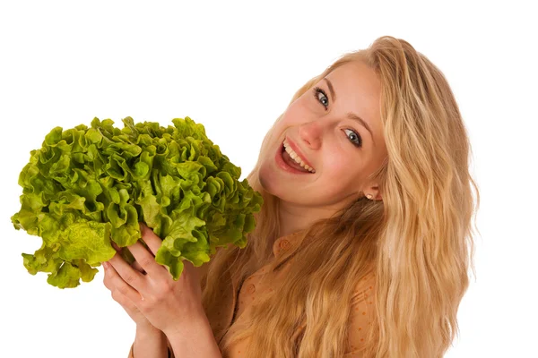 Beautiful young caucasian blonde woman holds a green salad as a — Stock Photo, Image