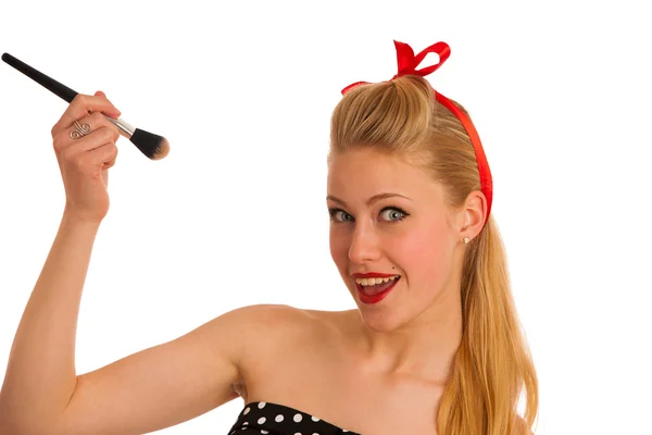 Beautiful young woman applying makeup with a brush — Stock Photo, Image