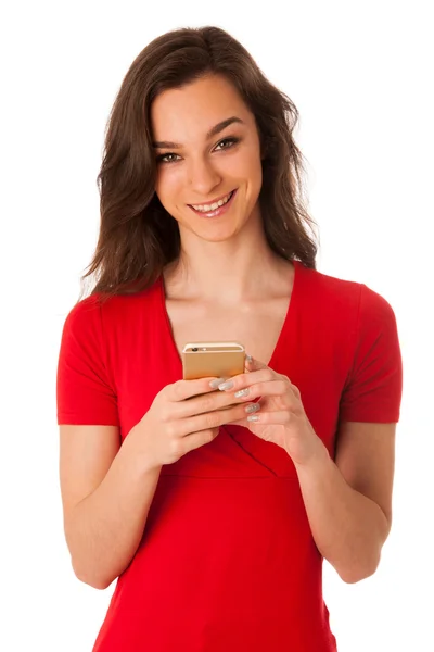 Beautiful young woman speaking on a cell phone isolated over white — Stock Photo, Image