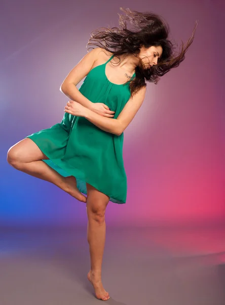 Young brunette caucasian woman dancing — Stock Photo, Image