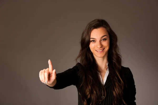 Beautiful young asian caucasian woman pressing a button on trans — Stock Photo, Image