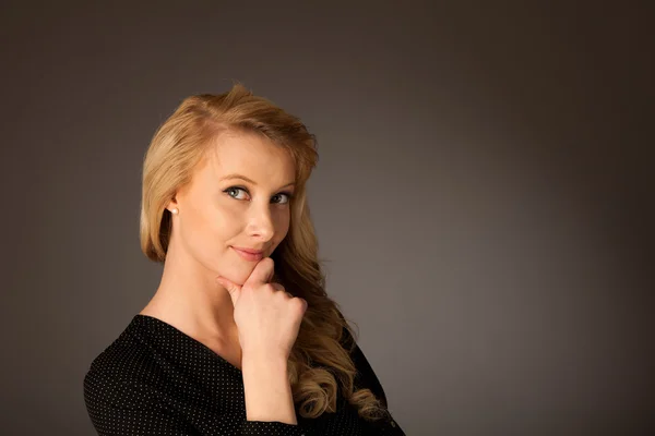 Pretty pensive caucasian blonde business woman looking into copy — Stock Photo, Image