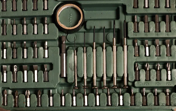 Tool set of screwdriver bits with different nozzles stowed in a — Stockfoto