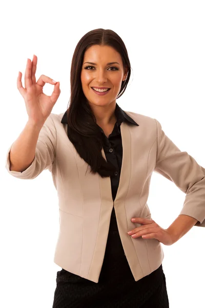 Mujer haciendo gestos de éxito con señal de ok y gran sonrisa feliz . — Foto de Stock