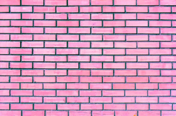 風化した古いピンクのレンガの壁の背景 — ストック写真