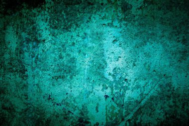 Eski yeşil duvar lekeler, çatlaklar, lekeler. Soyut grunge tarzı çatı katında boyanmış beton duvar. Arkaplan, portreler, posterler için klasik duvar arkaplan dokusu.