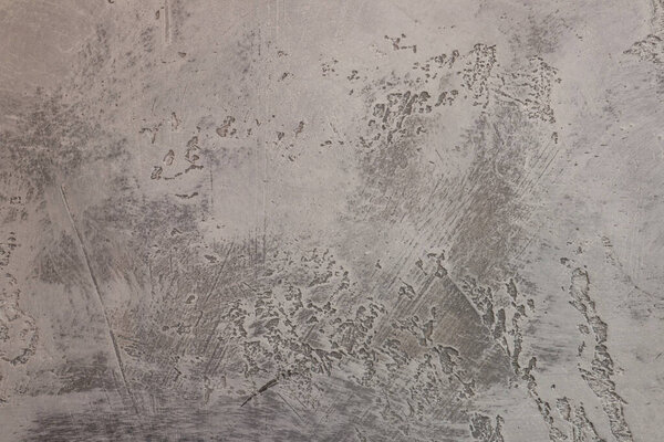 Абстрактный фон серой текстурированной бетонной стены. Селективный фокус