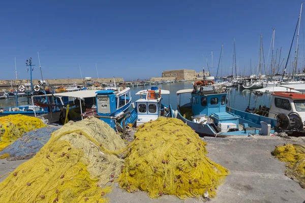 Fishing nets and fishing boats near Venetian fortress in the por — Stock Photo, Image