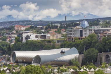 TBILISI, GEORGIA - MAY 07, 2016: People in apark in front of Con