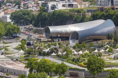 TBILISI, GEORGIA - MAY 07, 2016: People in apark in front of Con