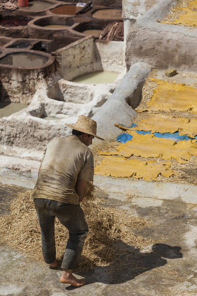 FEZ, MOROCCO - JUNE 10. 2016: Workers at the Chouwara tannery in