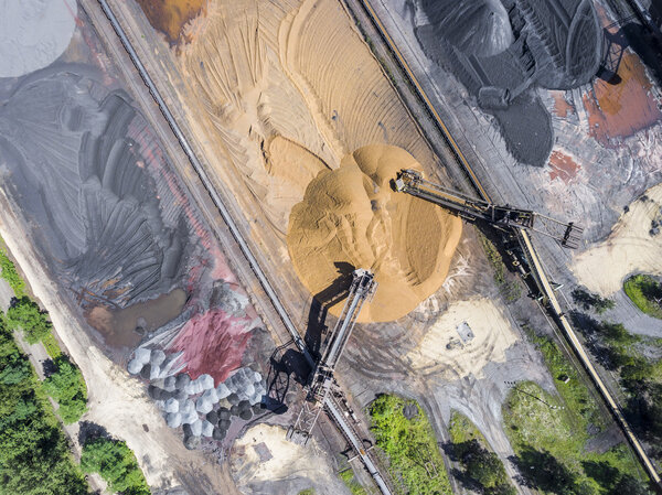 Mining excavator on the bottom surface mine. Brown coal deposits