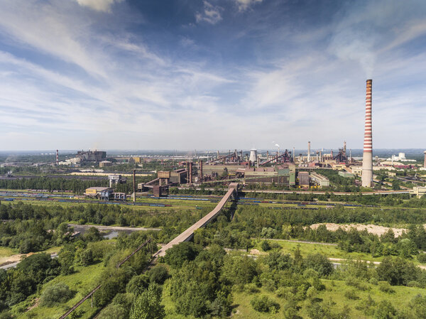 Steel factory with smokestacks at suny day.Metallurgical plant. 