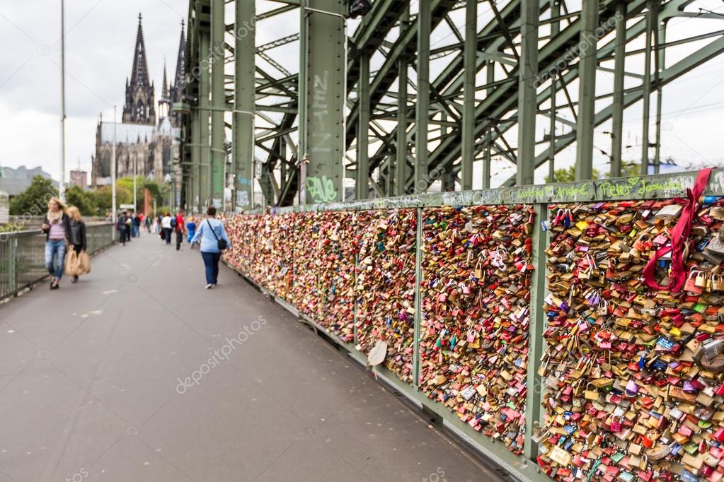 COLOGNE, GERMANY - AUGUST 26, 2014, Thousands of love locks which sweethearts lock to the Hohenzollern Bridge to symbolize their love on August 26 in Koln, Germany 