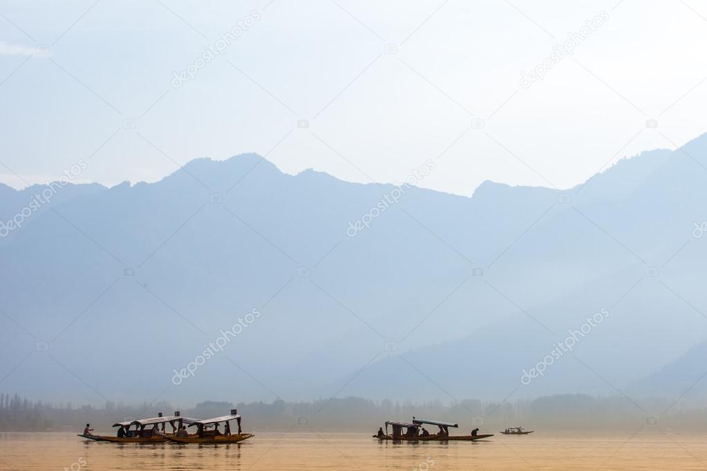 Peacefully Dal lake with snow mountain background in Srinagar, Kashmir India