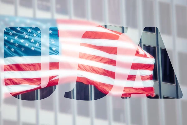 American flag in front of business building — Stock Photo, Image