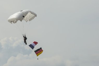 RADOM, POLAND - AUGUST 23: Parachutist with the diferent flags a